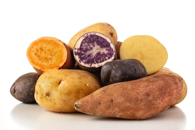 Sweet potatoes and various types of potatoes.