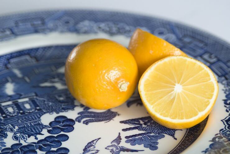 Meyer lemons on blue plate