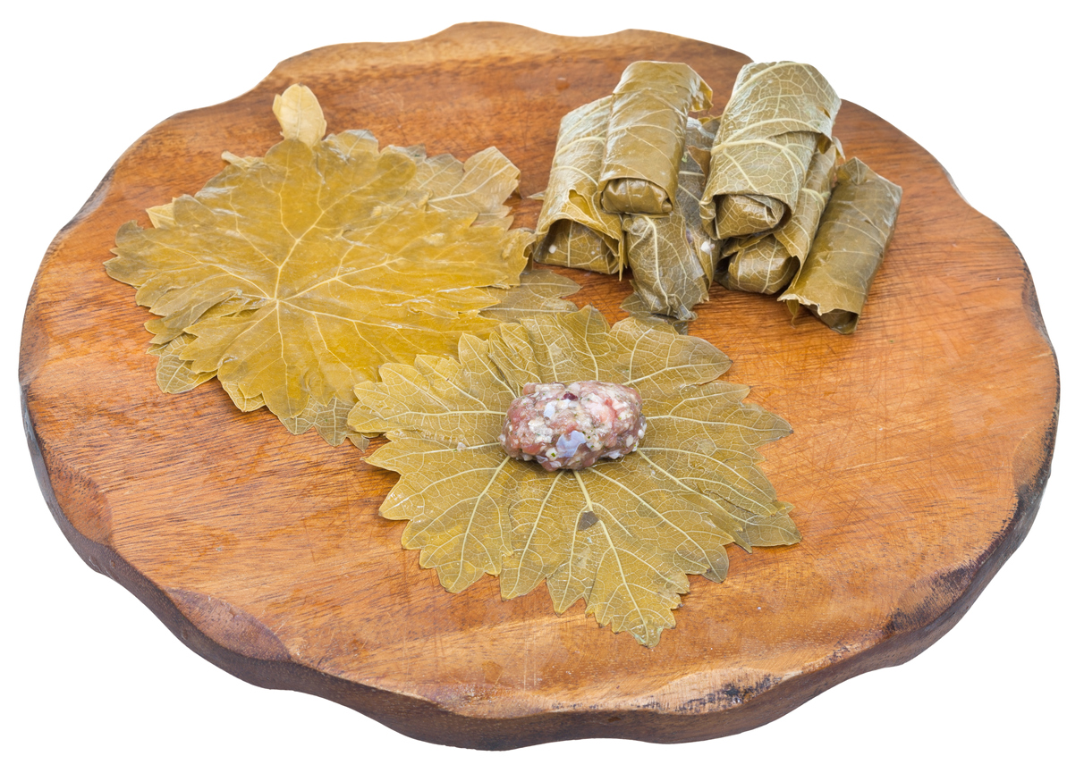 cooking of Caucasus meal - dolma from pickled grape leaves and mince