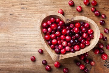 Healthy cranberries in a wooden bowl