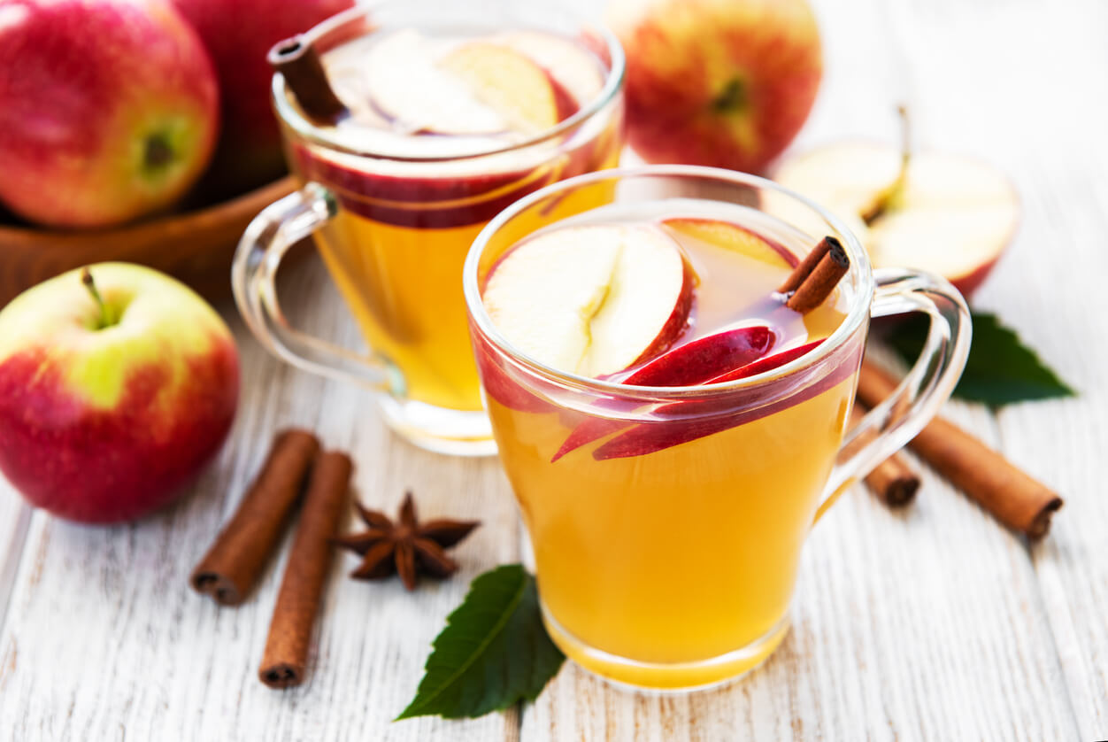 Apple cider with cinnamon sticks