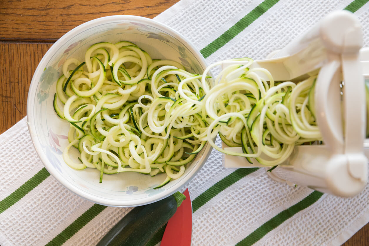 Vegetable spiralizer creating zucchini noodles