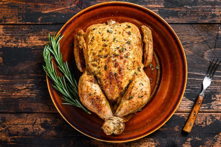 Delicious Baked Chicken on Wooden Table