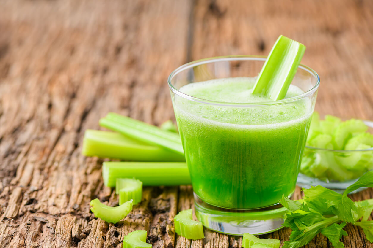 Fresh green celery juice in glass