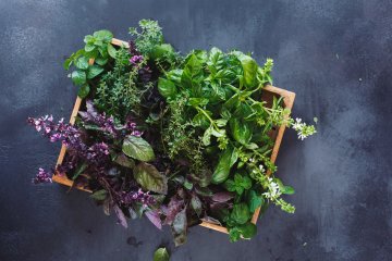 salad making in a wooden crate.