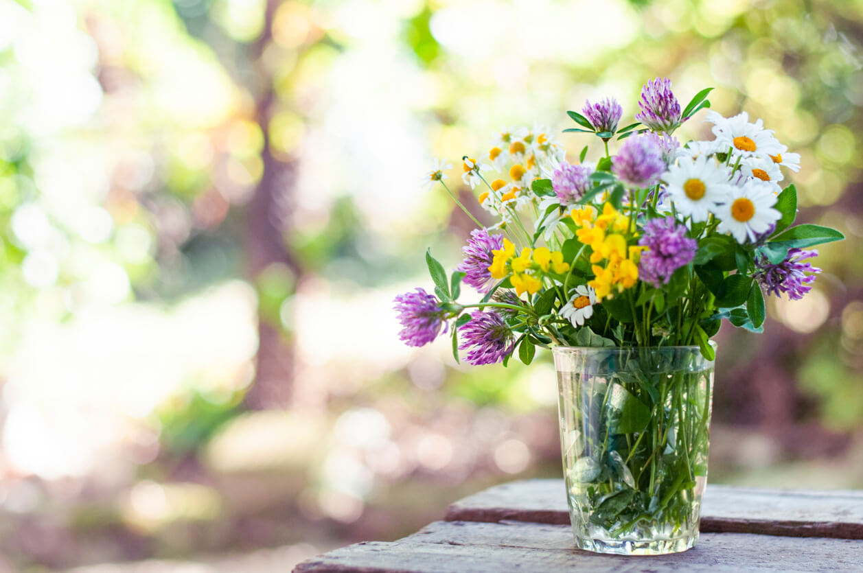 Bouquet of wildflowers on the wood table